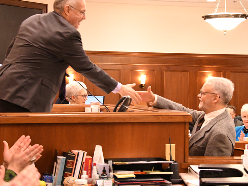 Representative Mike Prax is congratulated by Speaker of the House Rep. Edgmon after being sworn in to the House of Representatives