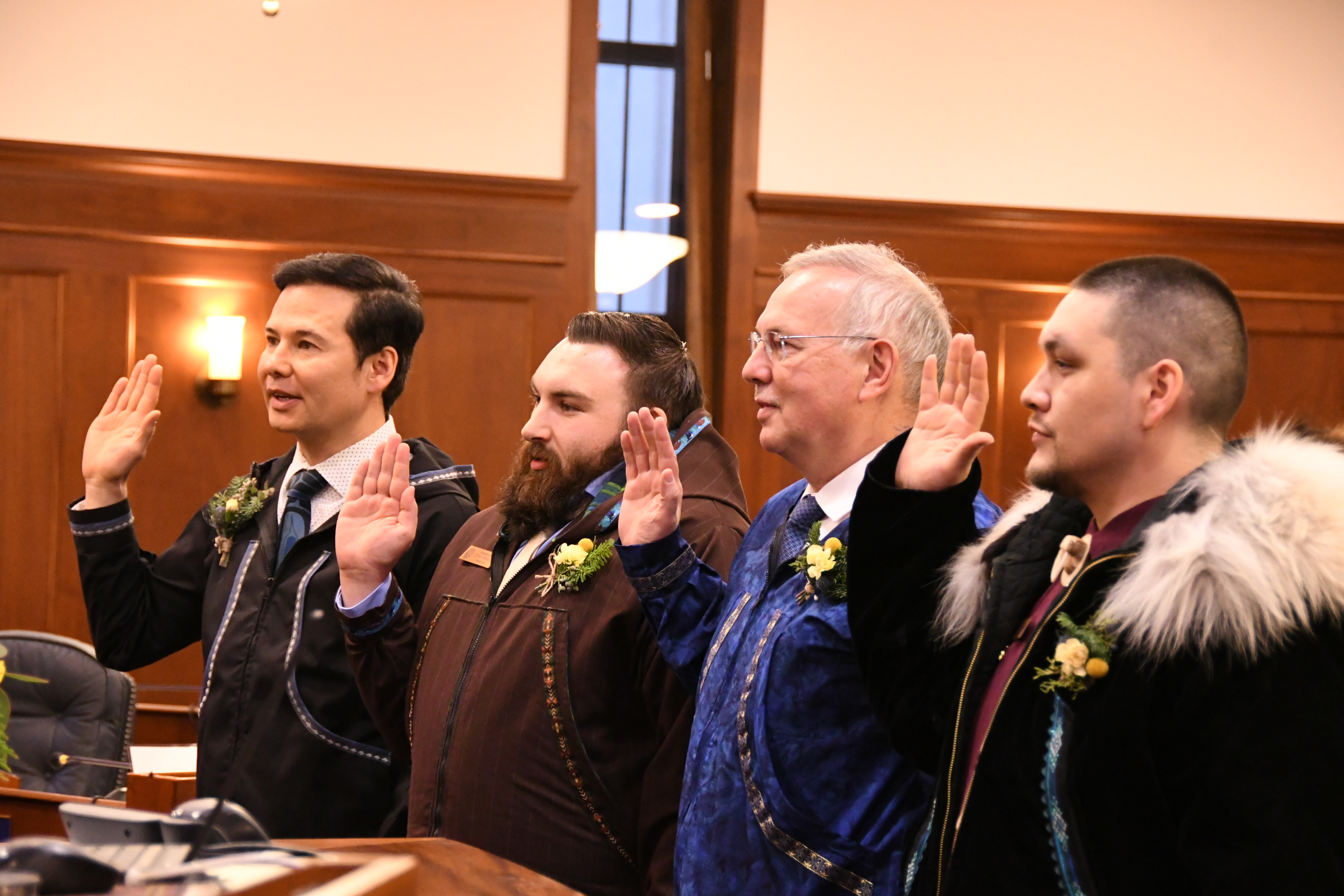 Representatives Foster, McCormick, Edgmon, and Patkotak are sworn in on the first day of the legislative session.